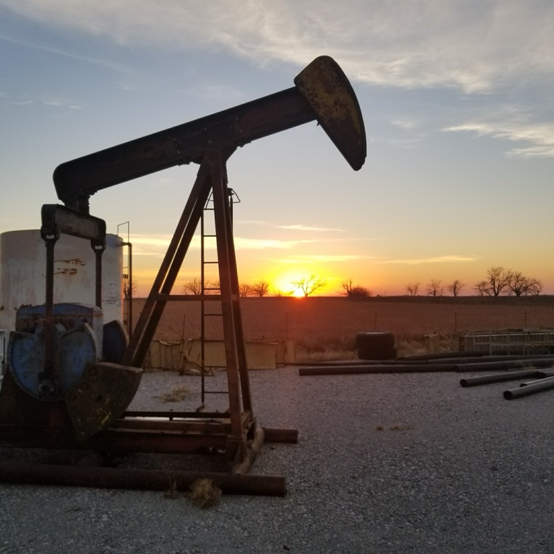 Pumpjack silhouetted against a sunset in Osage County, Oklahoma
